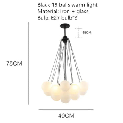 lustre moderne en métal avec boule en verre et bulles décoratives.